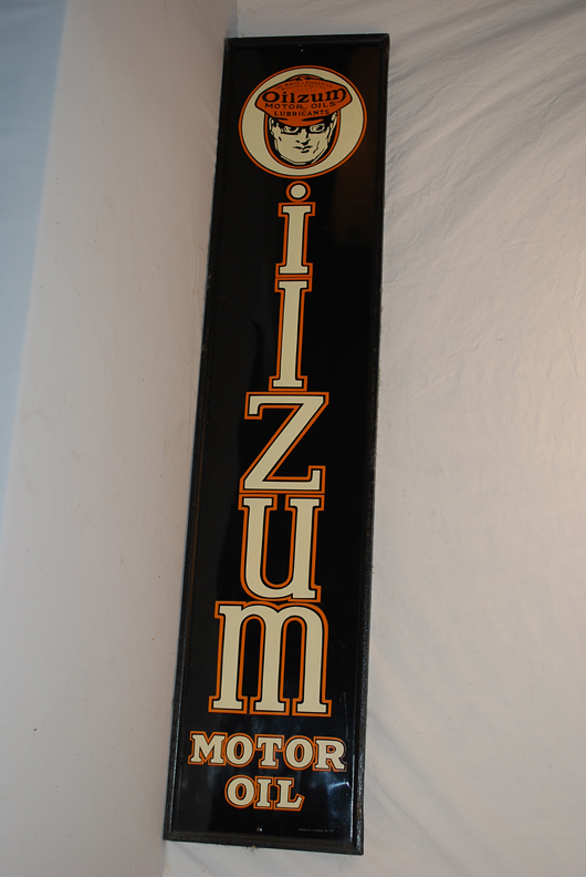 Oilzum Motor Oil single-sided tin sign with logo, framed, 61 inches by 13 inches, $4,510. Image courtesy of Matthews Auctions LLC.
